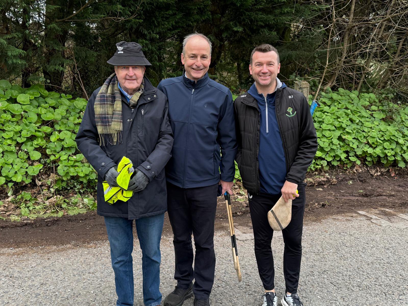 Club President Gerry Weldon, An Taoiseach Micheál Martin and Brian Twomey at the Ger Kiely Long Puck 2025